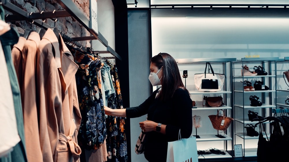 A woman found clothing aisle for shopping thanks to LED display